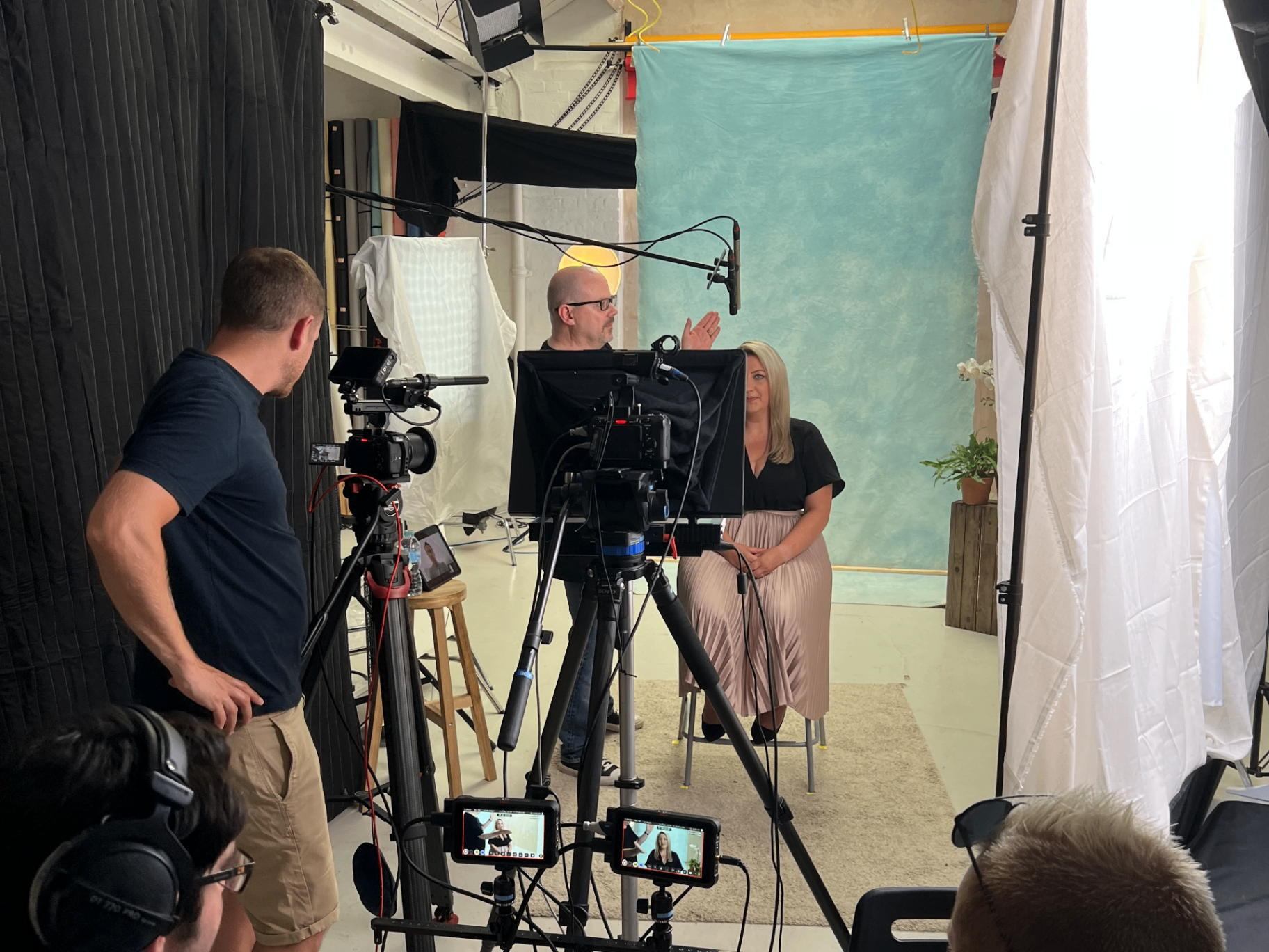 Direct Address production team filming an interview on set